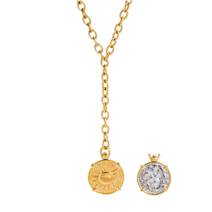 Gold necklace with two pendants on a white background