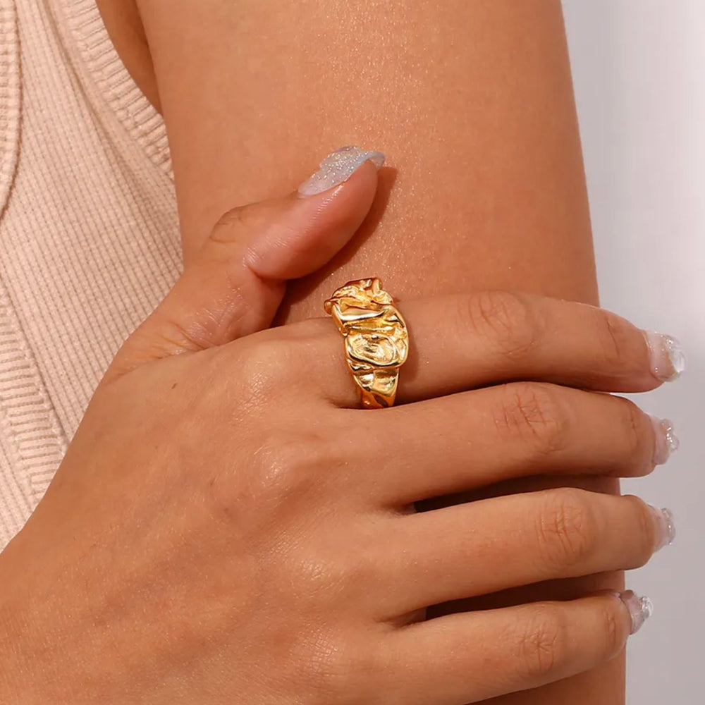 image of gold abstract chunky ring worn on model