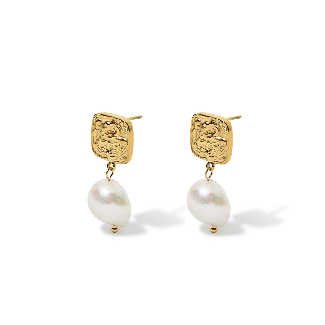 gold square button detail top with pearl dangly drop earring shown on a white background