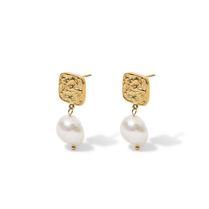 gold square button detail top with pearl dangly drop earring shown on a white background