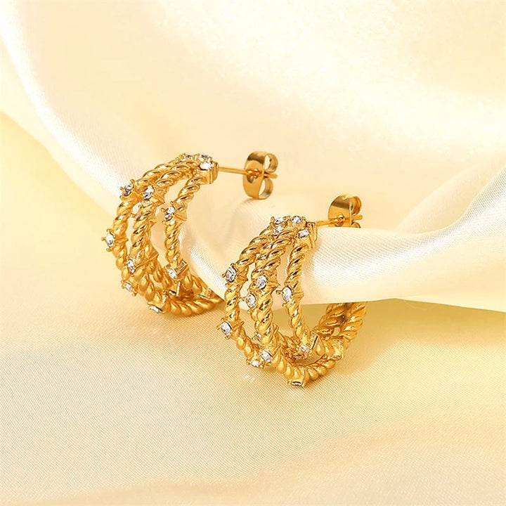 gold textured earrings with cubic zirconia