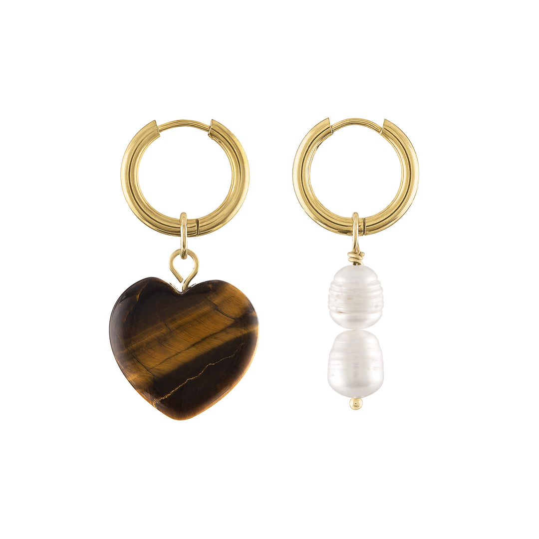 Olivia le aubrey tigers eye heart hoop earrings shown with gold hoop earrings and a brown heart charm on one earrings and pearl charms on the other earring as mismatched earring sets