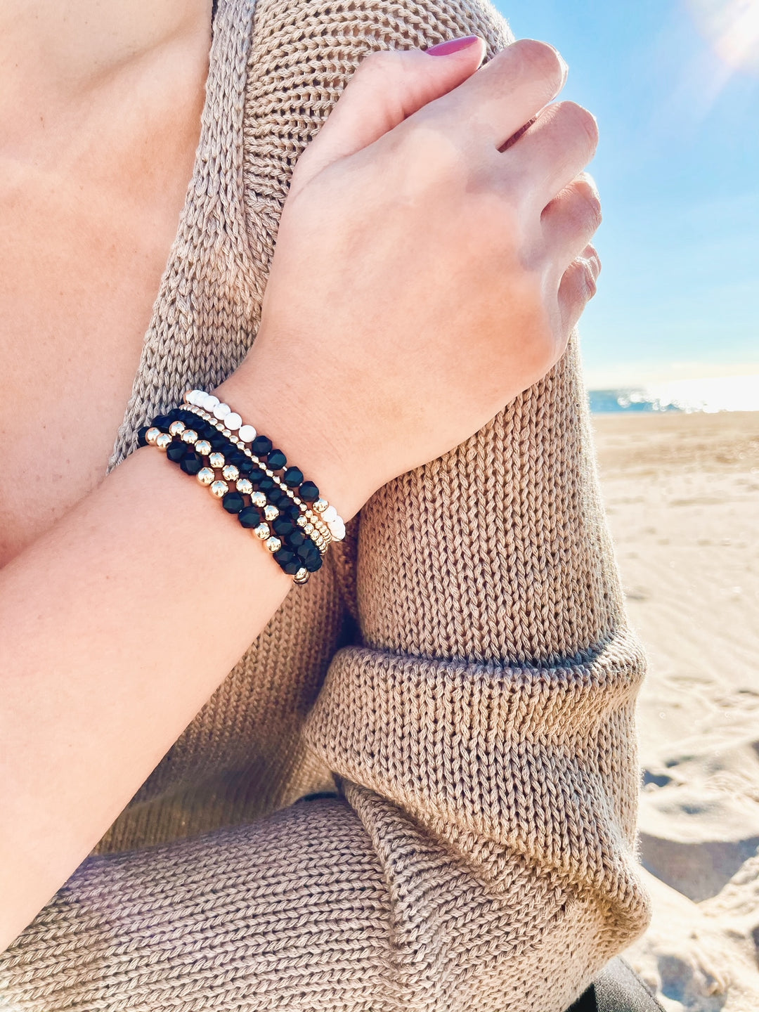 Olivia Le model wearing the Dreamy Black & White Gem Bracelet stack configuration