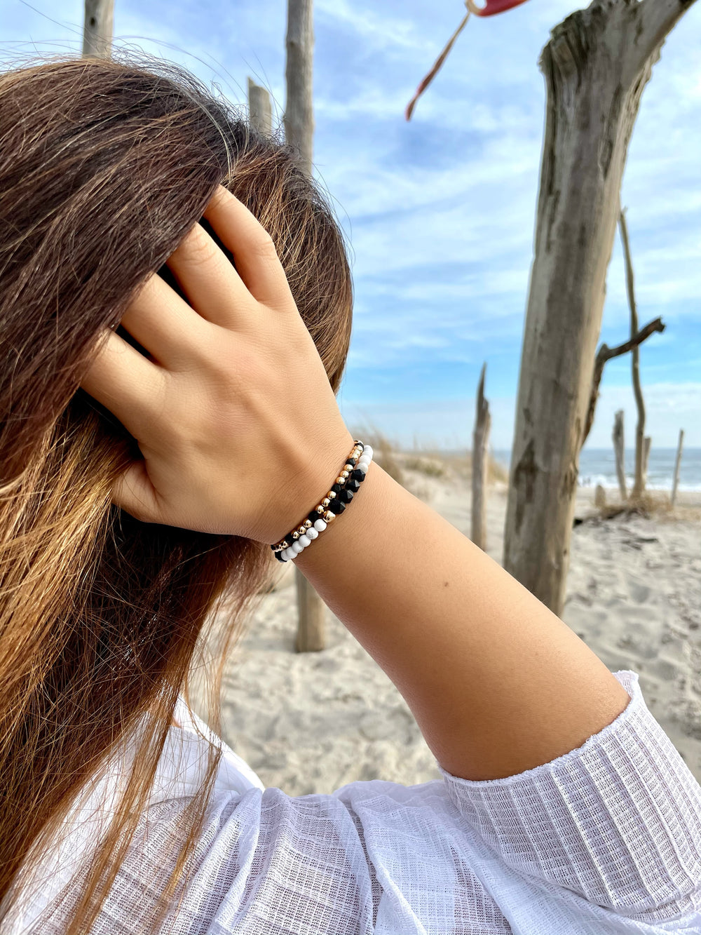 Olivia Le model wearing the Dreamy Black & White Gem Bracelet