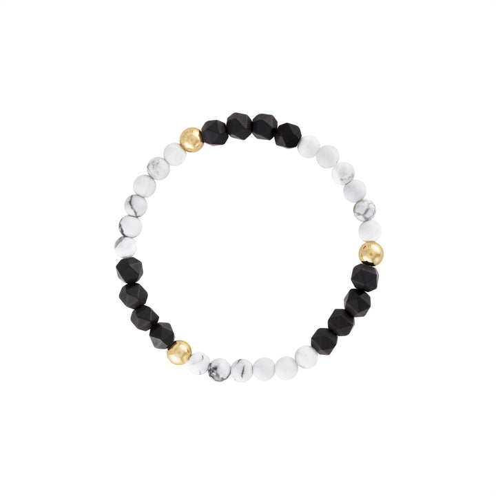 Olivia Le Dreamy Black & White Gem Bracelet handmade with 5MM 14K gold-filled beads 4MM howlite gemstones and 6MM black matte star faceted onyx gemstones available in 6.5 inch or 7 inch stretch 