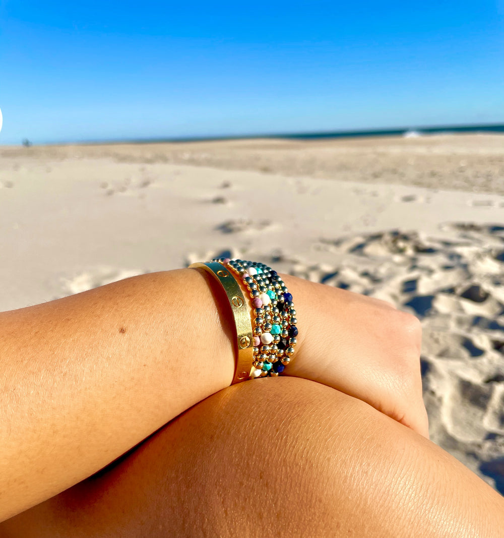 Olivia Le model wearing the blue sodalite gemstone gold-filled bubble bead bracelet