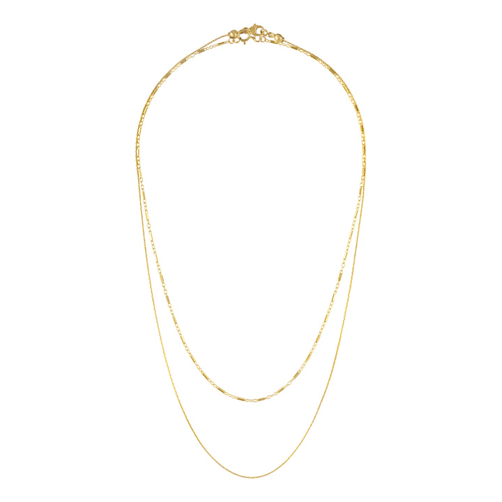 Olivia Le Jayden stack necklaces shows 2 necklaces that can be layered . Both necklaces are 14k gold filled dainty chains. One necklace is shorter at 14 inches and the other necklace is a thin beading chain that is longer at 17 inches