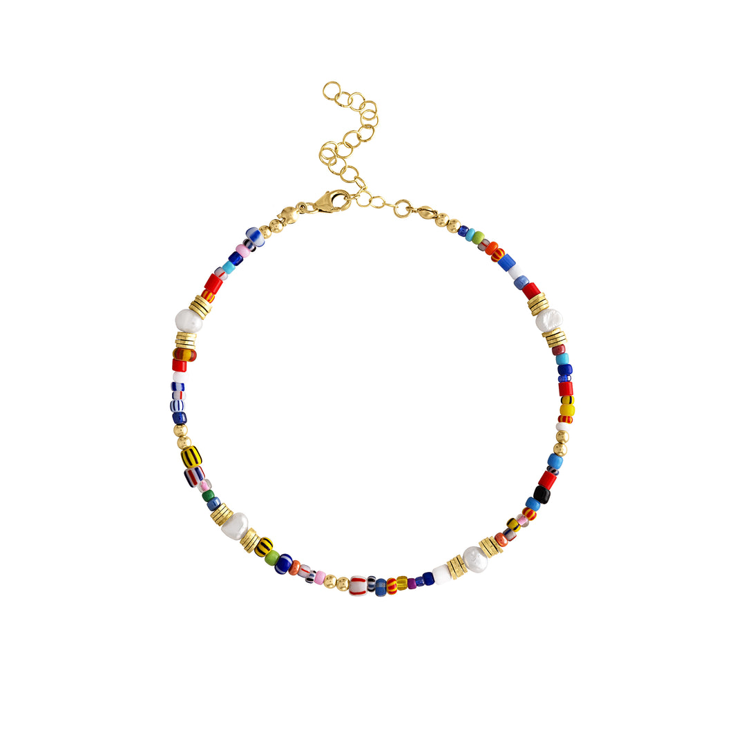 Olivia Le Jetsetter beaded anklet has many bright colors and patterns on beads using glass beads and fresh water pearls along with gold plated brass beads and gold filled bubble beads finished with a lobster clasp and extension. 