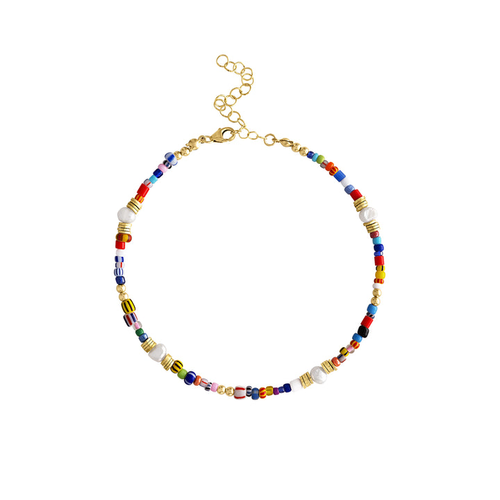 Olivia Le Jetsetter beaded anklet has many bright colors and patterns on beads using glass beads and fresh water pearls along with gold plated brass beads and gold filled bubble beads finished with a lobster clasp and extension. 