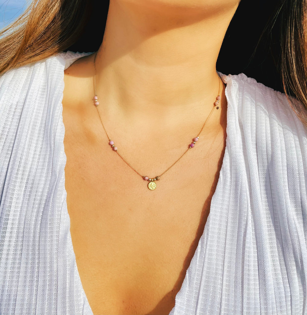 Olivia Le model wearing the Journey Phosphosiderite Beaded Necklace with Coin pendant and white top