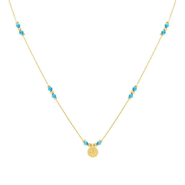 Olivia Le Journey Turquoise Magnesite Beaded Necklace with Coin pendant handmade with 14K gold-filled chain, 14K gold-filled 3MM beads, 3MM turquoise magnesite gemstones, and gold-plated Turkish coin pendant available in 18 inch length