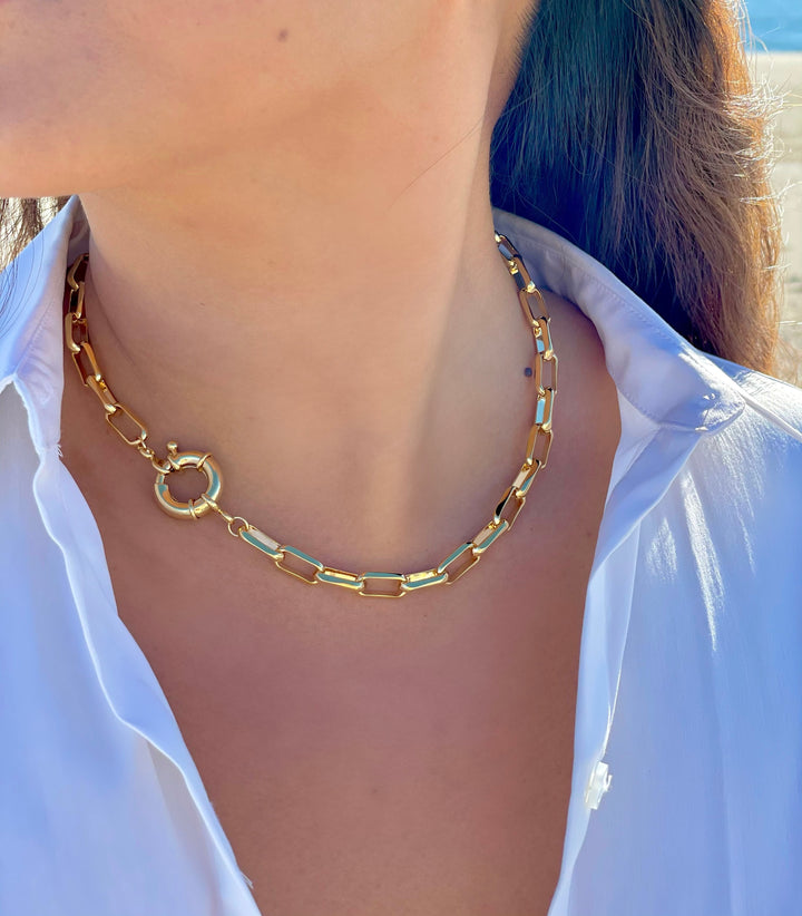 Olivia Le model wearing the Linked Up Necklace worn to the side with white top
