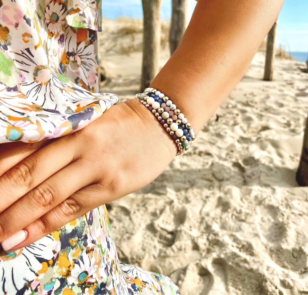 Olivia Le model wearing the Marbly Howlite Gem Bracelet with floral dress