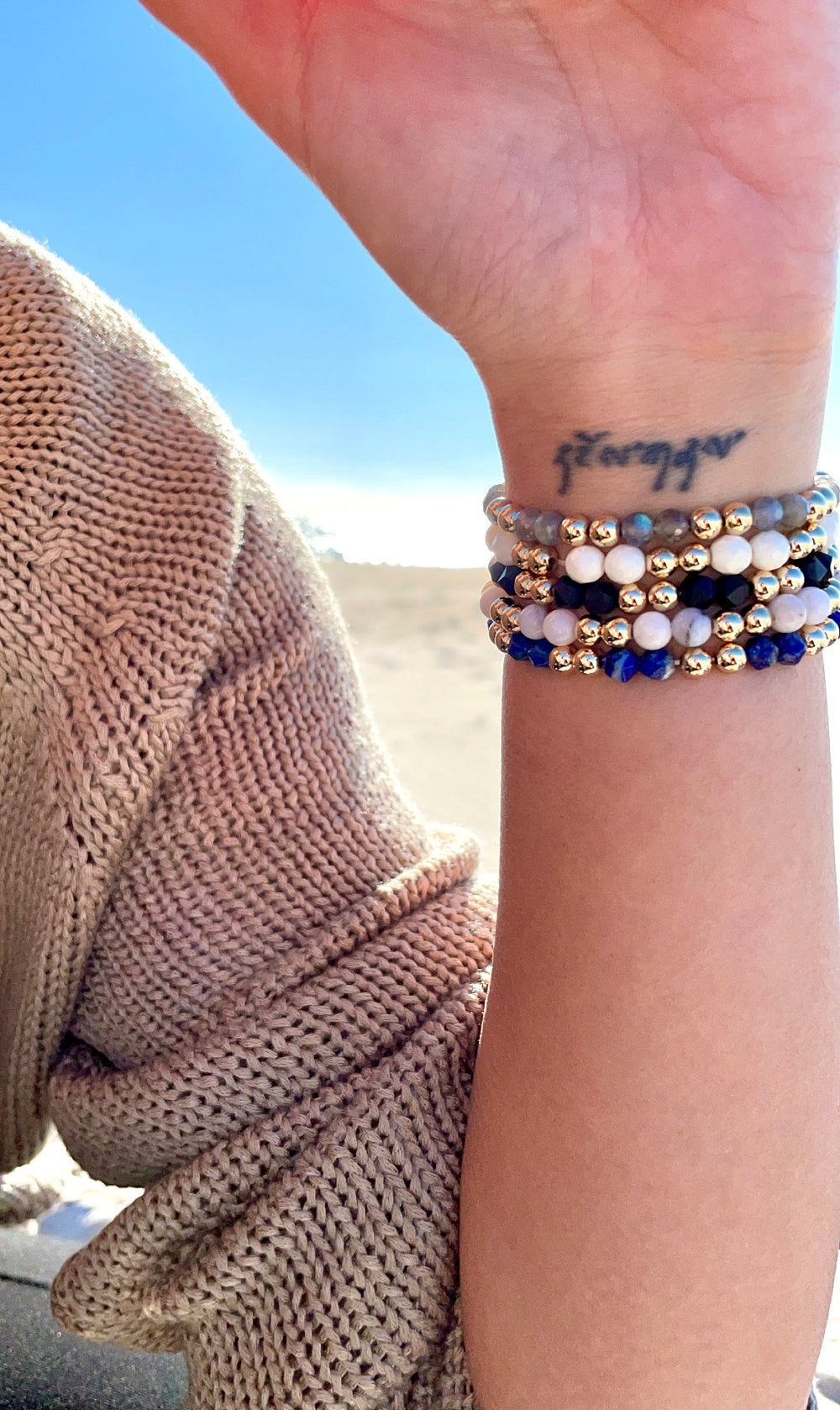 Olivia Le model wearing the Pink Opal Power Gem Gold Bubble Bracelet stack