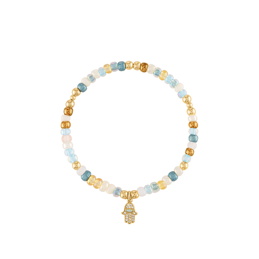 Oliva le  shimmer seed and czech beads with colors like the ocean and gold beads with a hamsa hand charm that has opal and cubic zirconia on a stretch elastic bracelet