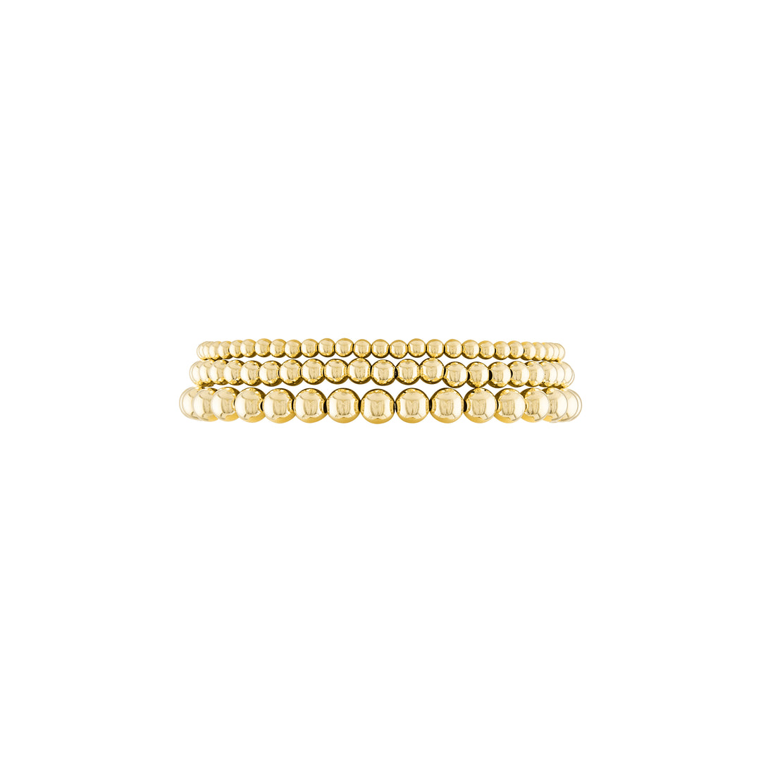 Olivia Le Trio Stack Bracelet Set handmade with 14K gold-filled 3MM, 4MM, and 5MM beads set includes three bracelets available in 6.5 inch or 7 inch stretch