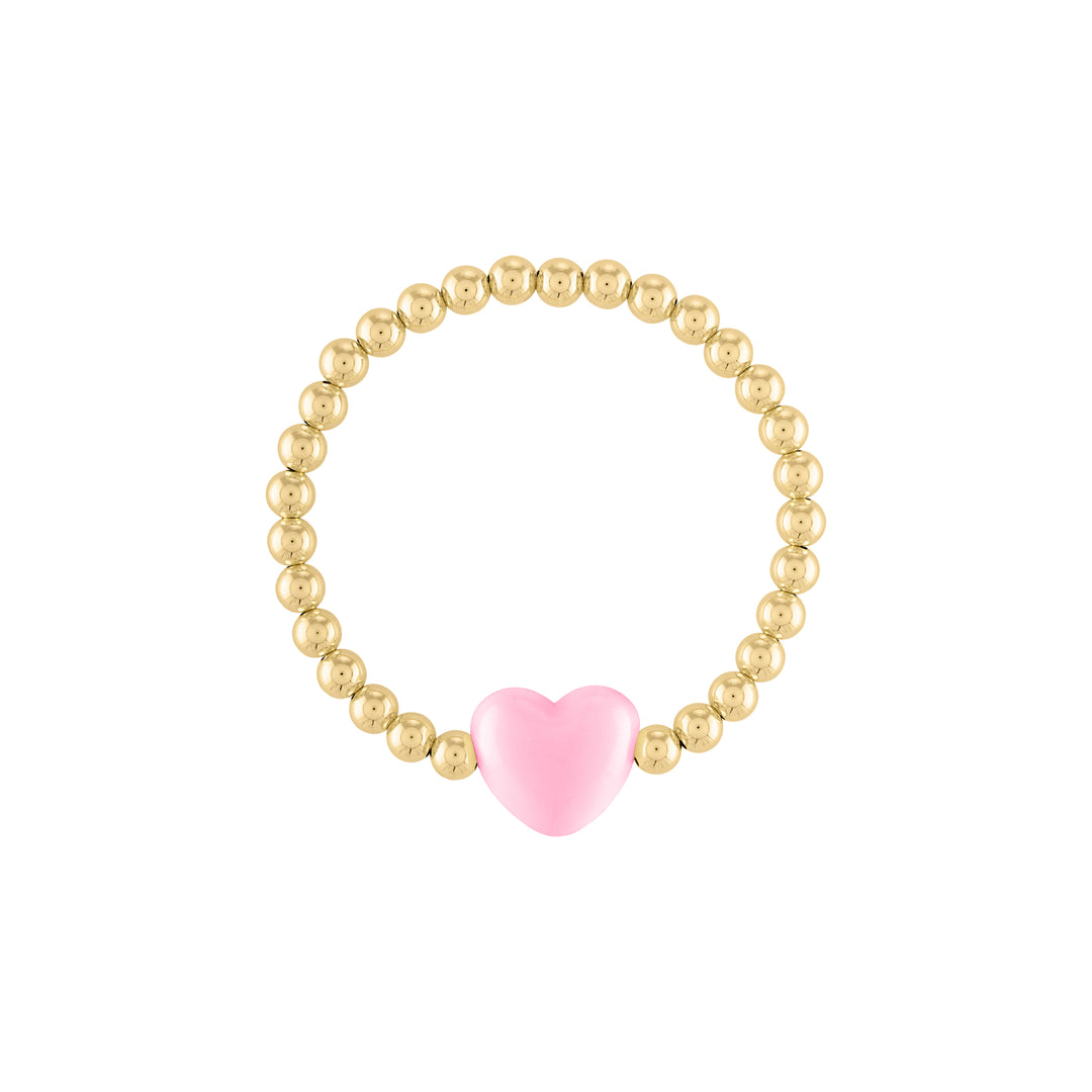 Olivia le love heart bracelet shown with 5mm 14k gold filled round beads with a large pastel pink puff heart bead charm in the middle on a stretch bracelet