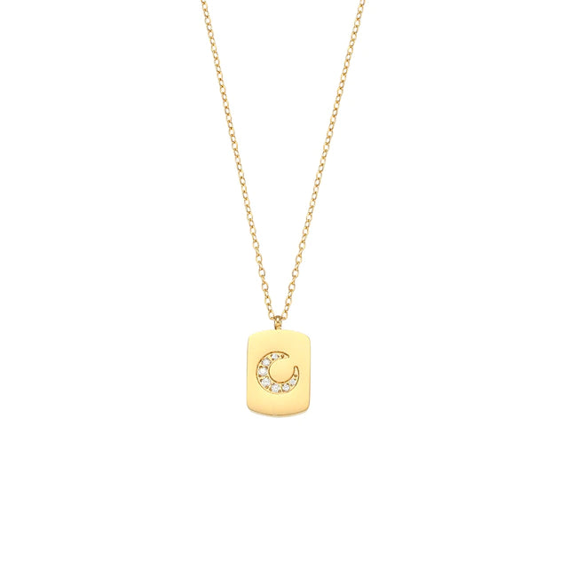 olivia le thin gold chain necklace with a gold pendant with a crescent shaped pave pendant 