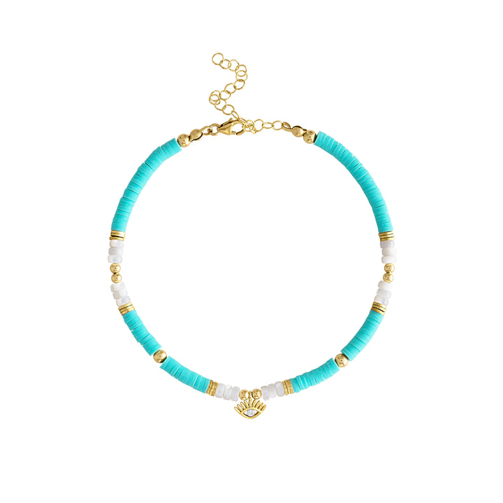 Olivia Le St. Topez anklet is a beautiful aqua colored anklet made with aqua polymer clay heishi beads and mother of the pearl beads and embellished with gold plated brass discs and spaced with 3mm and 4mm 14 gold filled beads . there is an evil eye charm that is gold plated and adorned with a turquoise eye. All finished with a lobster clasp and extender making this anklet adjustable from 8 inches to 10 inches.
