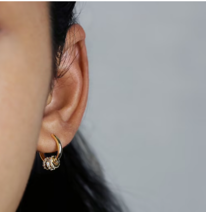 olivia le emma convertible pave hoop earrings shown on model showcasing on ear