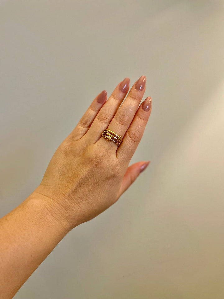 model wearing stacked ring on middle finger to show layered look