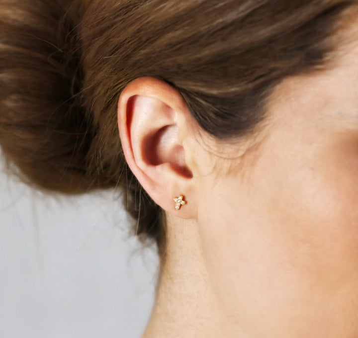 olivia le pave gold stud earrings shown on model wearing on left ear lobe