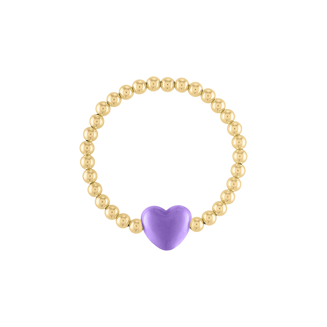 Olivia le love heart bracelet shown with 5mm 14k gold filled round beads with a large pastel purple puff heart bead charm in the middle on a stretch bracelet