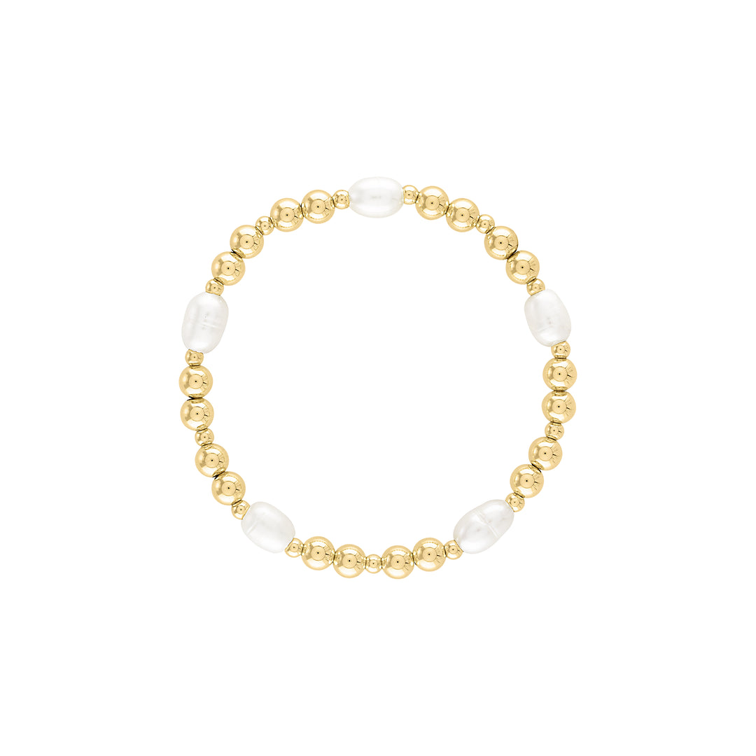 Olivia Le pearla bracelet shown with 5mm and 3mm gold  filled beads with alternating pattern and medium sized freshwater pearls beaded on a stretch bracelet