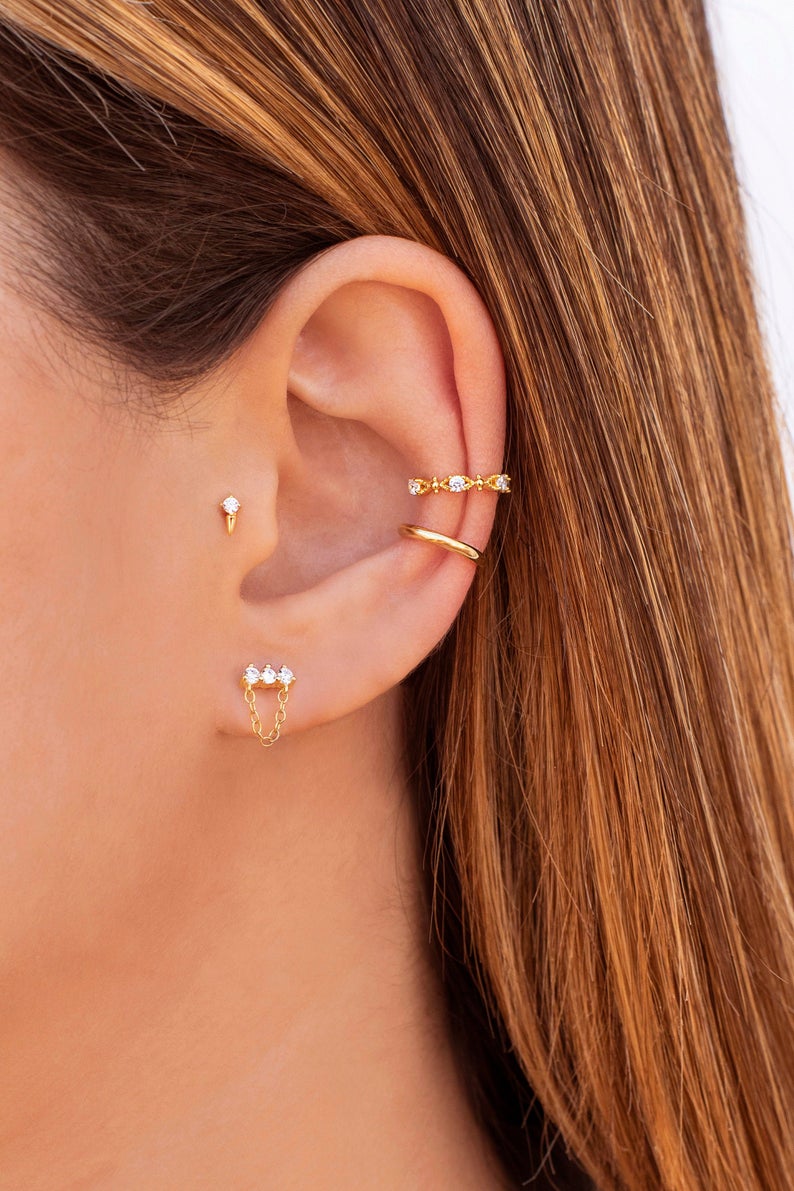 Olivia Le model wearing earrings on lobe modeling monroe spike stud earrings
