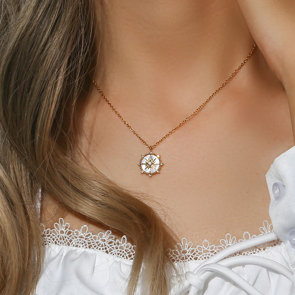model wearing olivia le pearl north star pendant necklace on model 