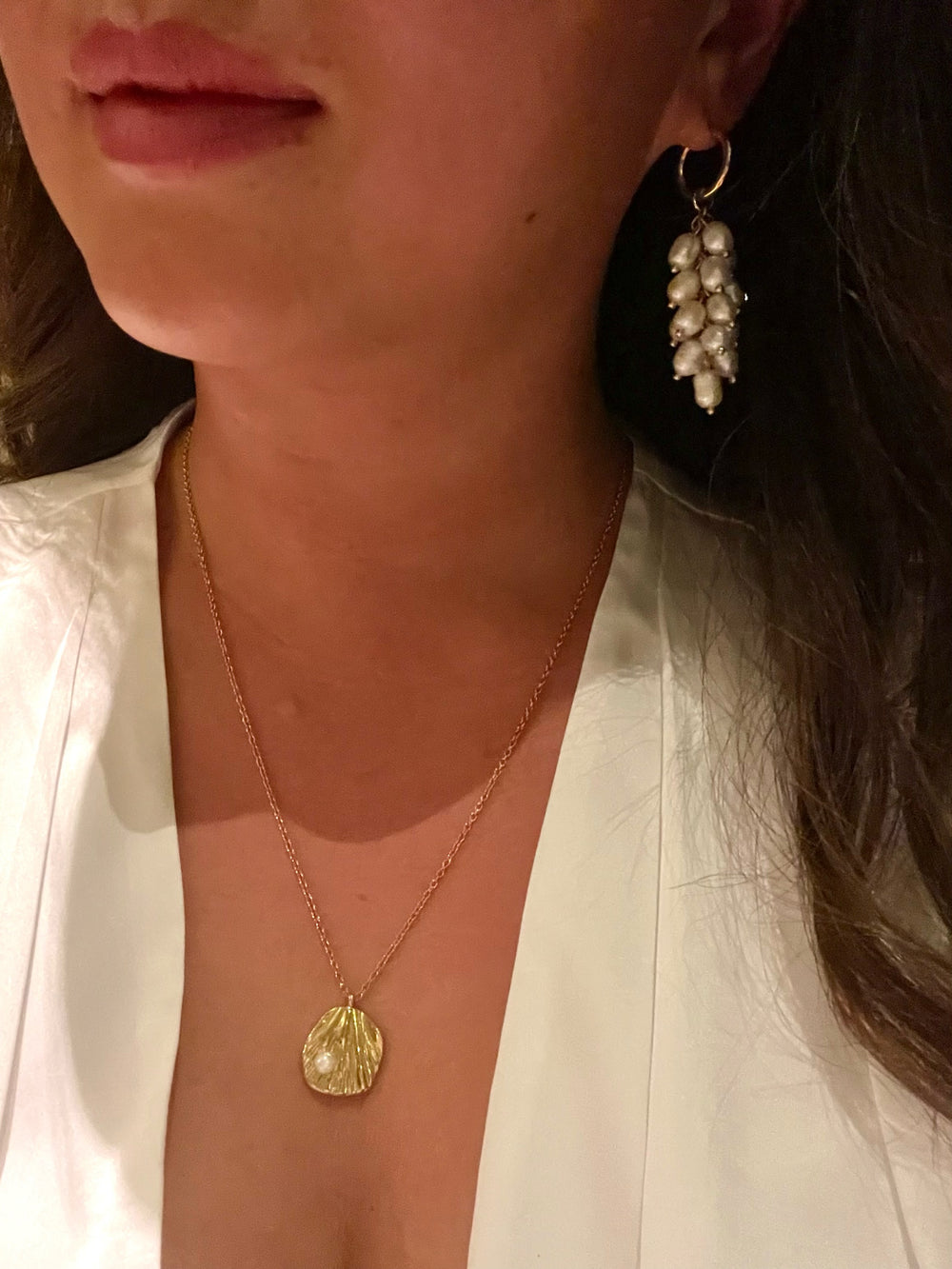 Olivia Le azalea freshwater pearl hoop earrings shown on model wearing on her ears 