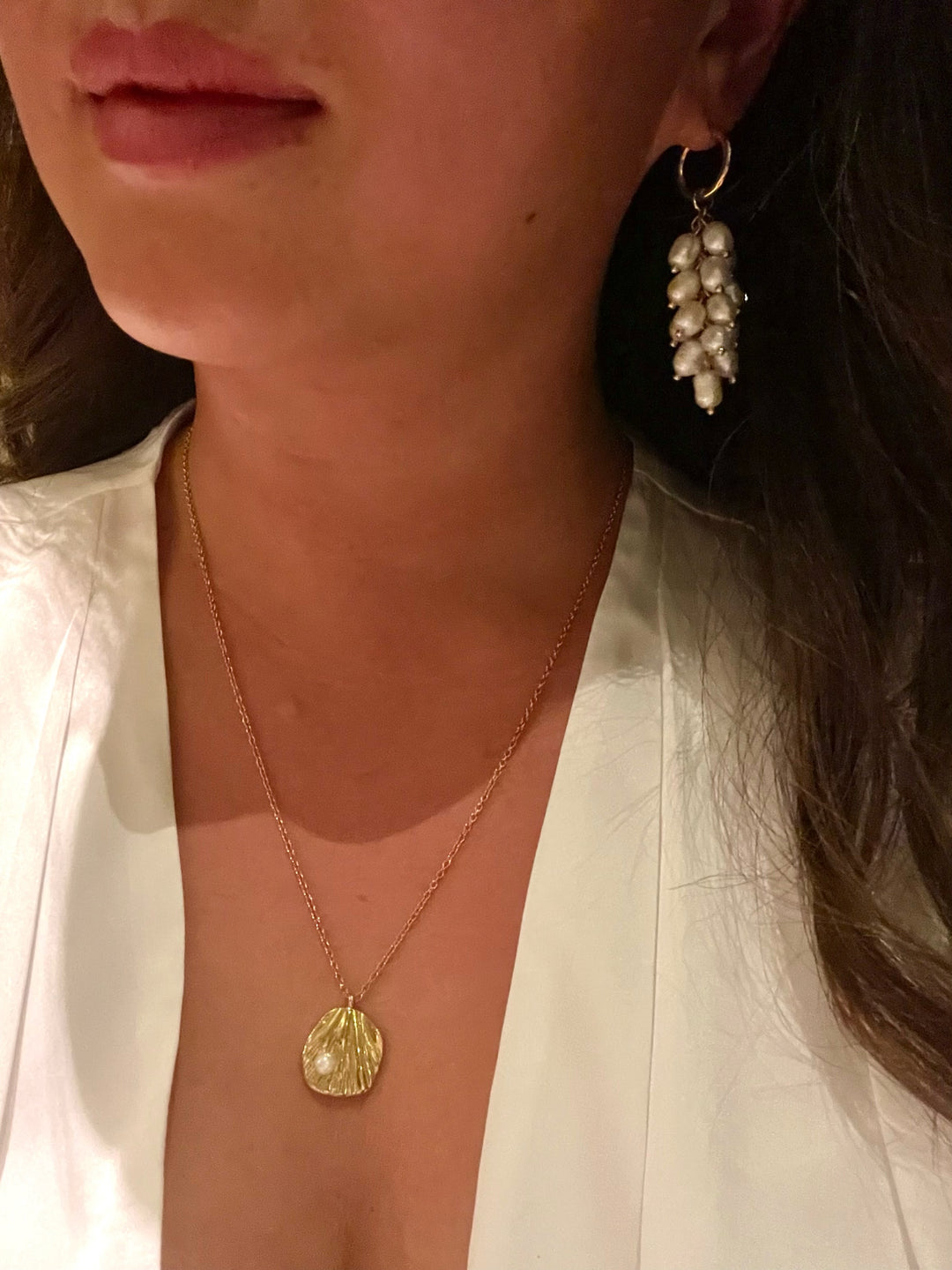 Olivia Le azalea freshwater pearl hoop earrings shown on model wearing on her ears 
